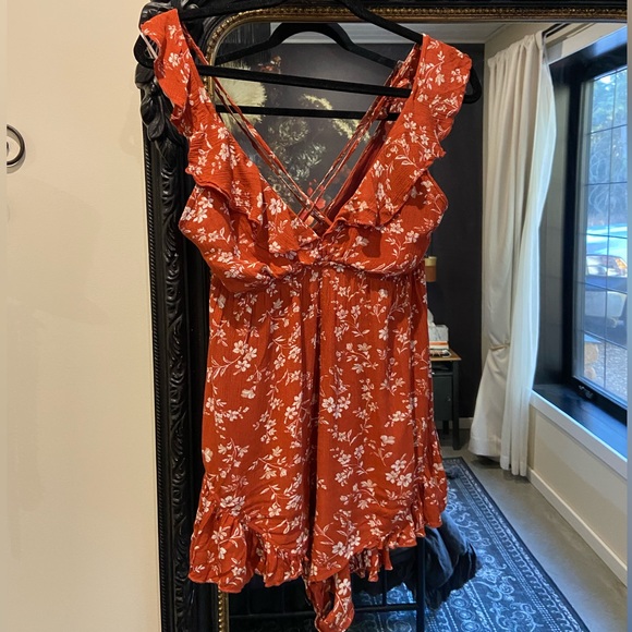 Burnt orange floral romper with ruffles and crisscross back (adjustable) - Picture 4 of 7